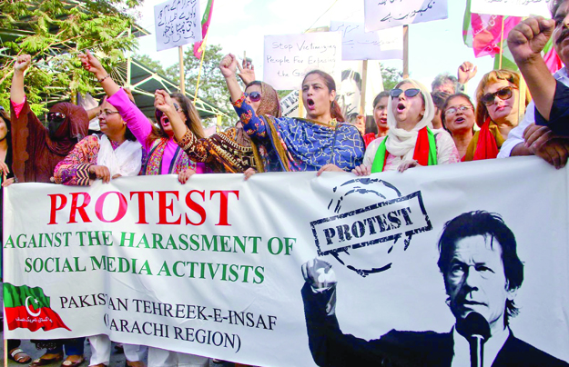 pti activists protest against the arrest of social media activists outside the karachi press club photo inp