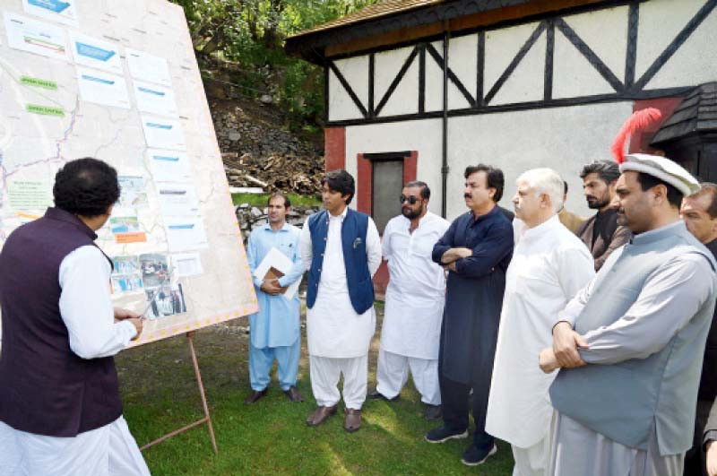 k p cm mahmood khan gets a briefing on flood relief activities in the province photo express