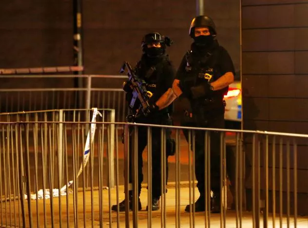 armed police officers stand next to a police cordon outside the manchester arena where u s singer ariana grande had been performing photo reuters armed police officers stand next to a police cordon outside the manchester arena where u s singer ariana grande had been performing photo reuters