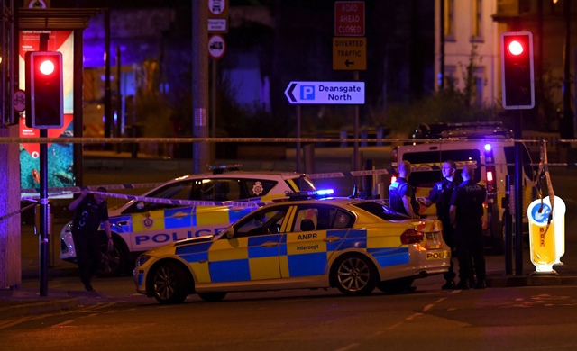 police deploy at scene of explosion in manchester england on may 23 2017 at a concert photo afp