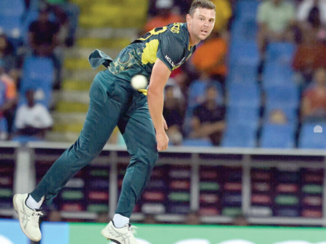 australia s josh hazlewood in action against india photo afp australia s josh hazlewood in action against india photo afp