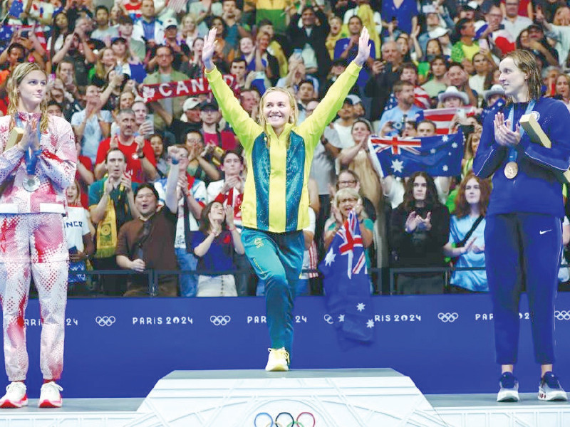 gold medallist ariarne titmus centre of australia silver medallist summer mcintosh left of canada and bronze medallist katie ledecky of united states celebrate photo reuters