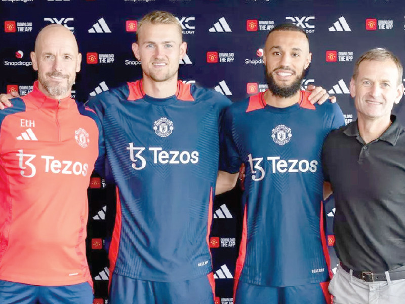 matthijs de ligt and noussair mazraoui pose with team manager erik ten hag after completing their deal with manchester united photo afp