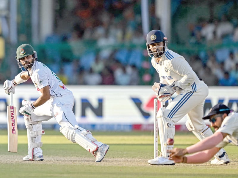 bangladesh s shadman islam l watches as india s virat kohli drops a catch in slips on the fourth day of kanpur test on monday photo afp