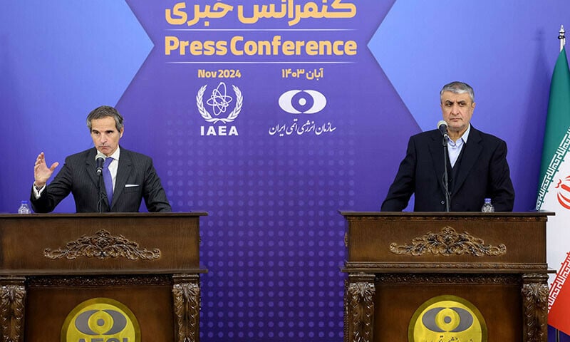 iran s head of the atomic energy organisation mohammad eslami and the united nations nuclear chief rafael grossi hold a joint press conference in tehran iran on november 14 2024 photo afp