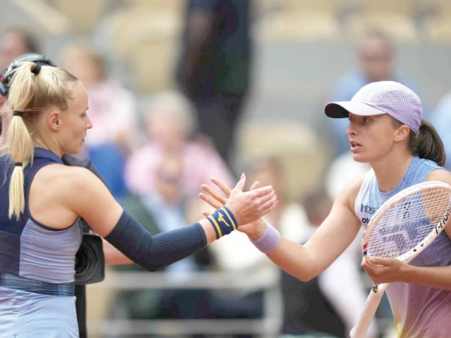poland s iga swiatek shakes hands with slovakia s rebecca after beating her in their french open clash at the roland garros on monday photo afp