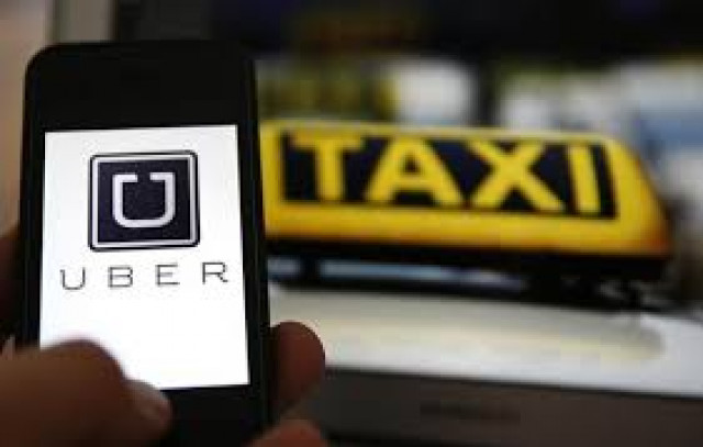 an illustration picture shows the logo of car sharing service app uber on a smartphone photo reuters an illustration picture shows the logo of car sharing service app uber on a smartphone photo reuters