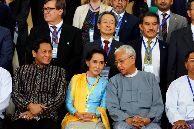 myanmar state counselor aung san suu kyi c chats with myanmar 039 s president htin kyaw after opening ceremony of 21st century panglong conference in naypyitaw myanmar may 24 2017 photo reuters