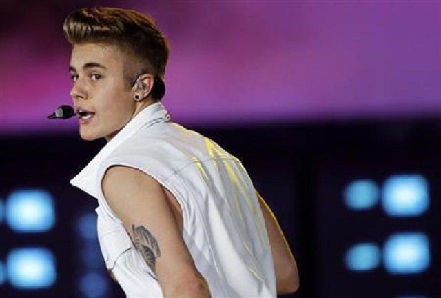 canadian singer justin bieber performs on stage during a concert as part of his quot believe quot world tour at the sevens stadium in dubai photo reuters