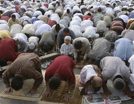 indonesian muslims attend prayers marking the end of the fasting month of ramadan on a street in jakarta photo reuters