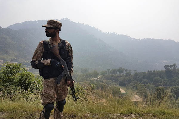 a pakistani soldier patrols a village in district bhimber near the line of control loc in pakistan administered kashmir during a media trip organised by the pakistani army on october 1 2016 tensions have been simmering for months between india and pakistan but were dangerously ratcheted up when india claimed it had carried out quot surgical strikes quot across the heavily militarised line of control loc the de facto border in disputed kashmir afp photo issam ahmed