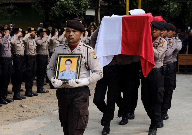 indonesia policemen carry the coffin of their colleague imam gilang adinata a victim of a bomb blast at kampung melayu bus station in jakarta indonesia may 25 2017 photo reuters