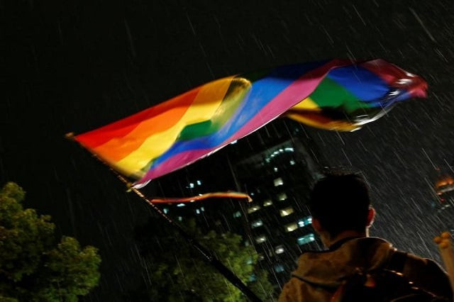 a supporter waves a rainbow flag during a rally after taiwan 039 s constitutional court ruled that same sex couples have the right to legally marry the first such ruling in asia in taipei taiwan may 24 2017 photo reuters a supporter waves a rainbow flag during a rally after taiwan 039 s constitutional court ruled that same sex couples have the right to legally marry the first such ruling in asia in taipei taiwan may 24 2017 photo reuters