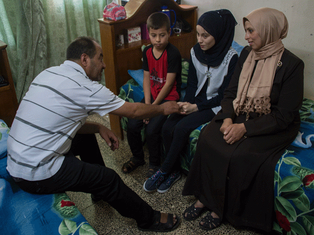 nour al ta 039 i c a 15 year old blind resident of east mosul and participant in quot al ghad star quot a radio talent contest organised by the al ghad studio based in the city of erbil sits in her room with her family at their home in mosul on may 18 2017 photo afp nour al ta 039 i c a 15 year old blind resident of east mosul and participant in quot al ghad star quot a radio talent contest organised by the al ghad studio based in the city of erbil sits in her room with her family at their home in mosul on may 18 2017 photo afp