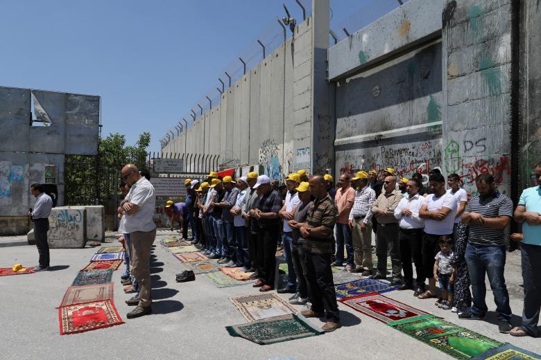 palestinians perform friday prayers before a protest in support of palestinian prisoners on hunger strike in israeli jails in the west bank town of bethlehem may 12 2017 photo reuters