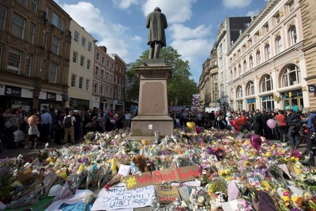 messages and floral tributes left for the victims of the attack on manchester arena lie around the statue in st ann 039 s square in central manchester may 24 2017 photo reuters messages and floral tributes left for the victims of the attack on manchester arena lie around the statue in st ann 039 s square in central manchester may 24 2017 photo reuters
