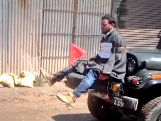 kashmiri youth tied in front of indian army vehicle as human shield photo twitter kashmiri youth tied in front of indian army vehicle as human shield photo twitter