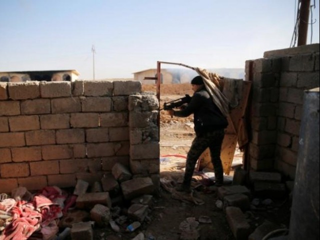 iraqi security forces take cover during clashes with islamic state militants north of mosul iraq december 30 2016 photo reuters