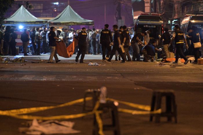 police investigate the scene of an explosion at a bus station in kampung melayu east jakarta indonesia photo reuters