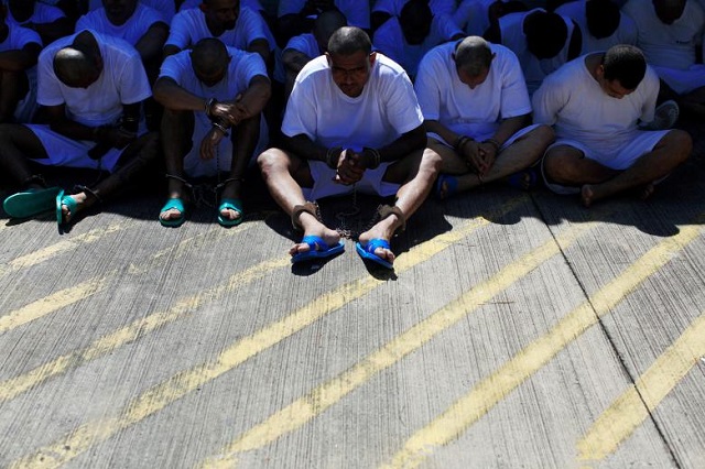 mara salvatrucha ms 13 gang members wait to be escorted upon their arrival at the maximum security jail in zacatecoluca el salvador photo reuters