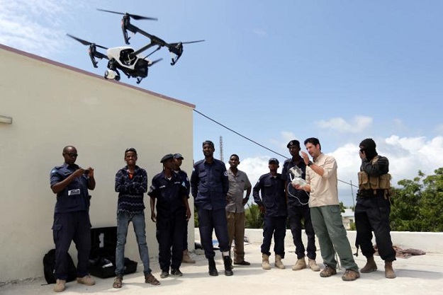 somali police officers watch instructor brett velicovich 2nd r fly a dji inspire drone during a drone training session for somali police in mogadishu somalia may 25 2017 photo reuters