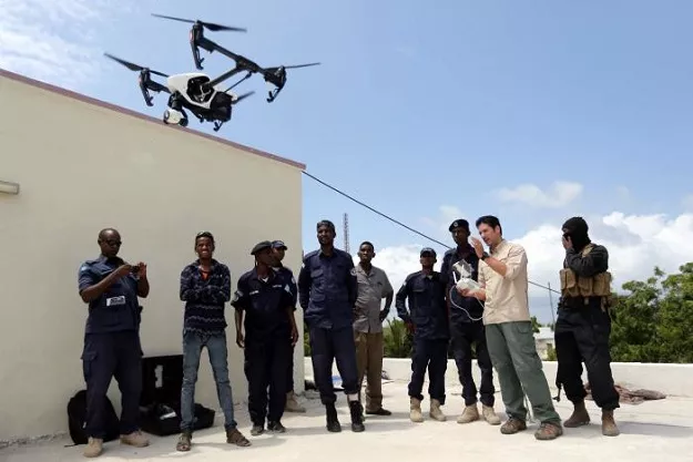 somali police officers watch instructor brett velicovich 2nd r fly a dji inspire drone during a drone training session for somali police in mogadishu somalia may 25 2017 photo reuters somali police officers watch instructor brett velicovich 2nd r fly a dji inspire drone during a drone training session for somali police in mogadishu somalia may 25 2017 photo reuters