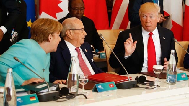 us president donald trump talks to german chancellor angela merkel l and tunisia s president beji caid essebsi 2 l at the g7 summit expanded session on may 27 2017 in taormina sicily photo afp