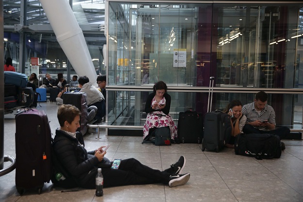 travellers stranded wait at heathrow airport terminal 5 after british airways flights where cancelled at heathrow airport in west london on may 27 2017 photo afp