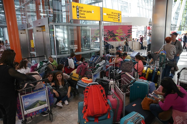 travellers wait stranded at heathrow airport terminal 5 after british airways flights where cancelled at heathrow airport in west london on may 27 2017 photo afp
