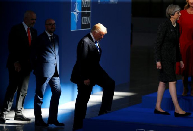president donald trump c follows britain 039 s prime minister theresa may as nato member leaders gather before the start of their summit in brussels belgium photo reuters president donald trump c follows britain 039 s prime minister theresa may as nato member leaders gather before the start of their summit in brussels belgium photo reuters