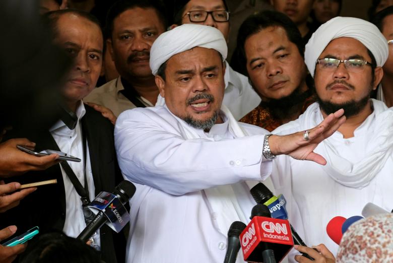 leader of islamic defenders front habib rizieq talks to reporters at a court after the blasphemy trial of jakarta 039 s incumbent governor basuki tjahaja purnama also known as ahok in jakarta indonesia february 28 2017 reuters