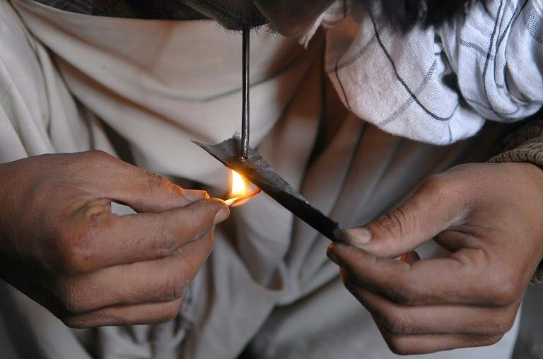 afghan asylum seekers in sweden say smoking heroin the highly addictive drug related to opium which afghanistan produces and distributes around the world helps ease their fear of being deported photo afp