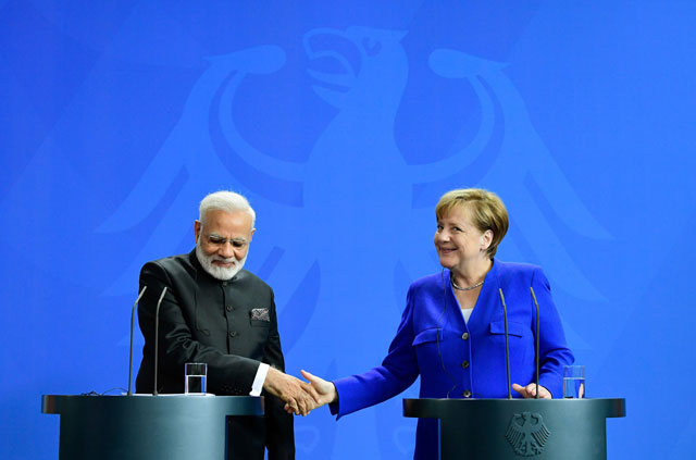 german chancellor angela merkel shakes hands with indian prime minister narendra modi during a press conference following talks and the signing of agrreements at the chancellery in berlin on may 30 2017 photo afp