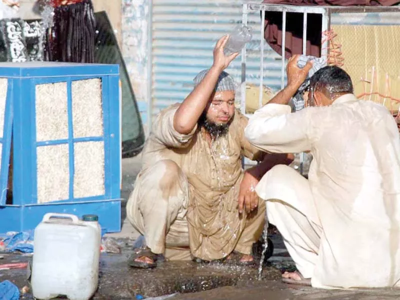 labourers taking a bath outside a shop at shoba bazaar to get relief from the scorching hot day in peshawar photo app labourers taking a bath outside a shop at shoba bazaar to get relief from the scorching hot day in peshawar photo app