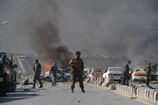 an afghan security force member stands at the site of a car bomb attack in kabul on may 31 2017 photo afp an afghan security force member stands at the site of a car bomb attack in kabul on may 31 2017 photo afp