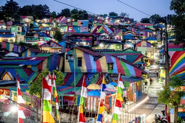 this picture shows an indonesian hamlet dubbed quot the rainbow village quot in semarang central java that has become an internet sensation and attracting hordes of visitors the village of about 200 modest homes on a hillside above a river used to be a typical low income indonesian neighbourhood that was filthy and gloomy but residents of the wonosari community in semarang decided an extreme makeover was needed and received money from the local government and several companies to carry out the project photo afp this picture shows an indonesian hamlet dubbed quot the rainbow village quot in semarang central java that has become an internet sensation and attracting hordes of visitors the village of about 200 modest homes on a hillside above a river used to be a typical low income indonesian neighbourhood that was filthy and gloomy but residents of the wonosari community in semarang decided an extreme makeover was needed and received money from the local government and several companies to carry out the project photo afp