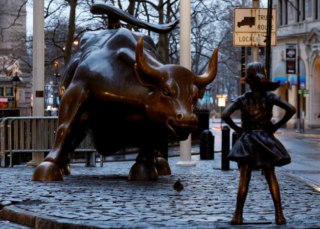 a statue of a girl facing the wall st bull in the financial district in new york us photo reuters