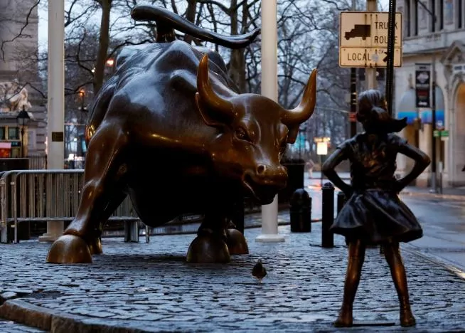 a statue of a girl facing the wall st bull in the financial district in new york us photo reuters a statue of a girl facing the wall st bull in the financial district in new york us photo reuters