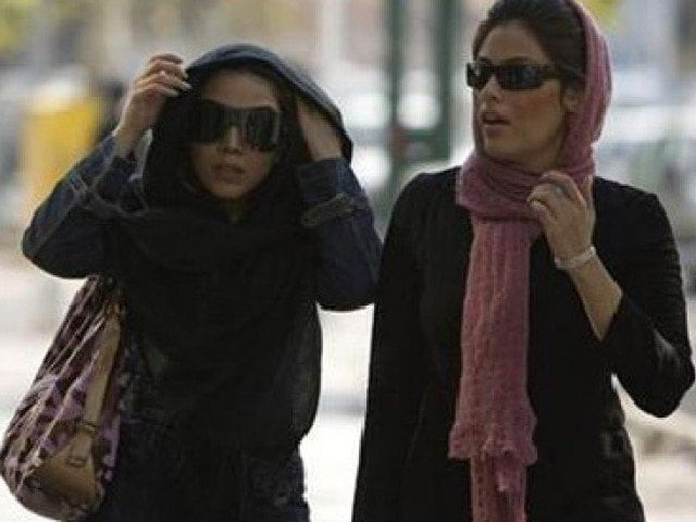 iranian women adjust their headscarves as they walk on a street photo reuters iranian women adjust their headscarves as they walk on a street photo reuters