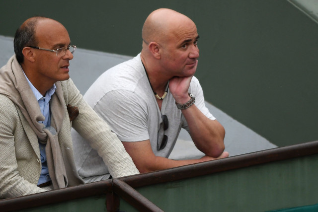 hard work agassi r watches djokovic playing against schwartzman as the former world number one was taken to five sets by the unfancied argentinian photo afp hard work agassi r watches djokovic playing against schwartzman as the former world number one was taken to five sets by the unfancied argentinian photo afp