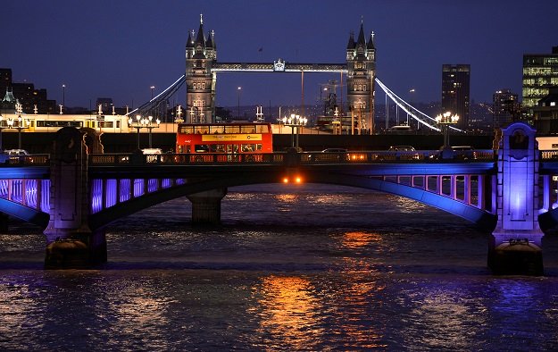 a london bus crosses the river thames on london bridge during the evening rush hour with tower bridge seen behind in london photo reuters