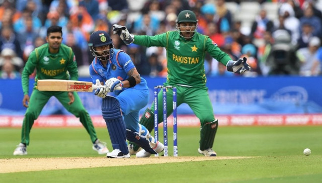 india 039 s virat kohli l bats as pakistan wicket keeper sarfraz ahmed r looks on during the icc champions trophy match between india and pakistan at edgbaston in birmingham on june 4 2017 photo afp india 039 s virat kohli l bats as pakistan wicket keeper sarfraz ahmed r looks on during the icc champions trophy match between india and pakistan at edgbaston in birmingham on june 4 2017 photo afp