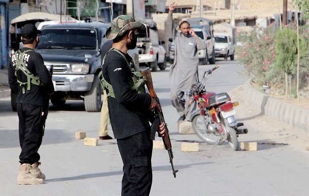 security personnel stand on spini road quetta after two members of the hazara community were gunned down there by unidentified men riding a motorcycle photo nni