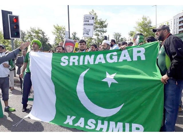 kashmiri protesters holding pakistani flag stage a demonstration outside the edgbaston cricket ground against indian atrocities in the held territory on june 4 2017 photo nni