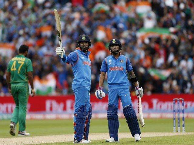 indian batsman yuvraj singh celebrates scoring half century as india capain virat kohli looks on photo reuters