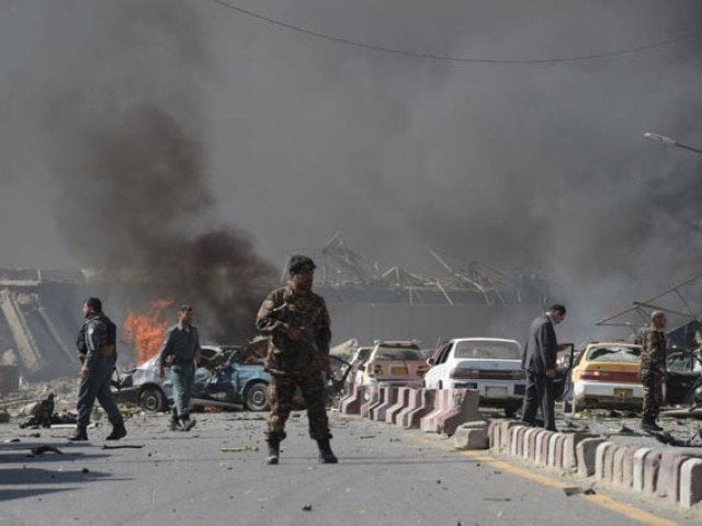 an afghan security force member stands at the site of a car bomb attack in kabul on may 31 2017 photo afp