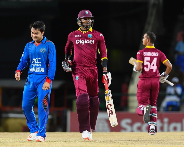 marlon samuels r of west indies get runs off rashid khan l of afghanistan during the 3rd and final t20i match between west indies and afghanistan at warner park basseterre st kitts june 05 2017 photo afp