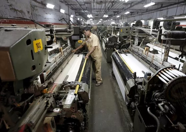 a man working in a textile industry photo reuters a man working in a textile industry photo reuters