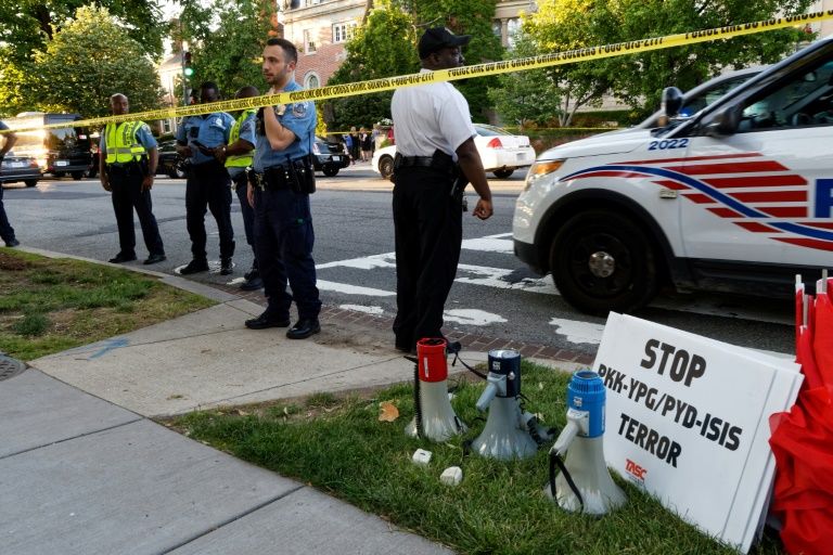 police secure the street outside the turkish embassy during a visit by turkish president recep tayyip erdogan on may 16 2017 in washington dc photo afp