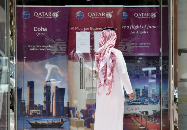 a man stands outside a qatar airways branch in the saudi capital riyadh after it was forced to suspended all flights to saudi arabia photo afp a man stands outside a qatar airways branch in the saudi capital riyadh after it was forced to suspended all flights to saudi arabia photo afp